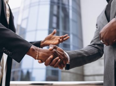 african-business-male-people-shaking-hands-min